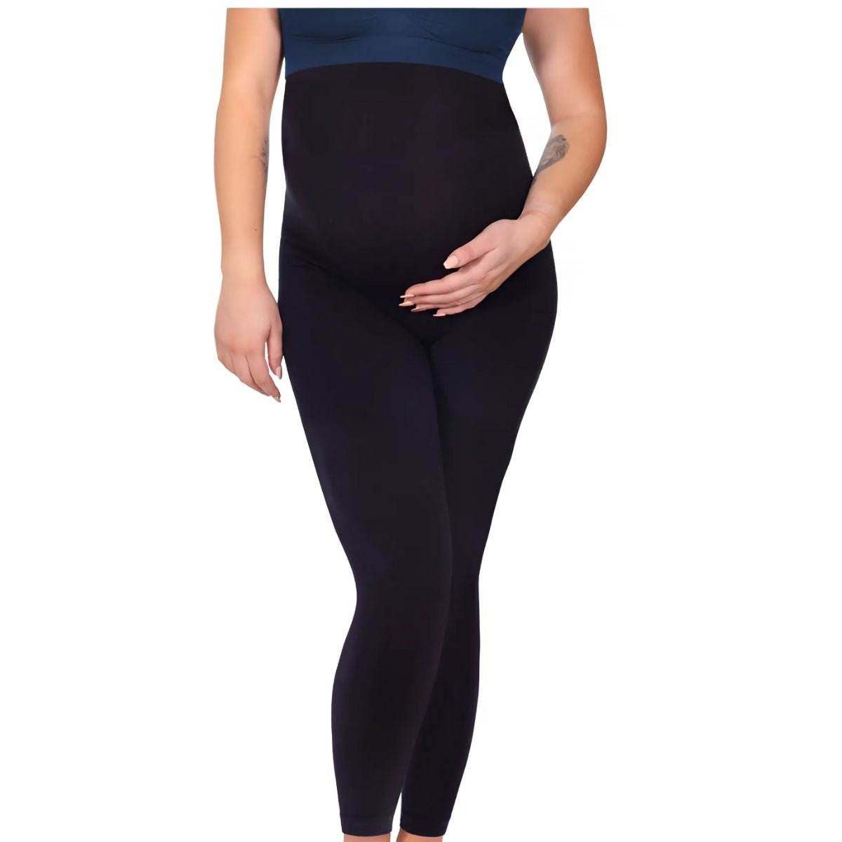 Maternity Leggings in black with a smooth, opaque finish and high over-the-bump waistband worn by a pregnant model