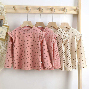 Toddler wearing Feather & Fawn ribbed ruffle long sleeve top