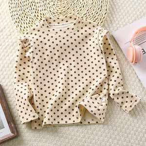 Toddler wearing Feather & Fawn ribbed ruffle long sleeve top