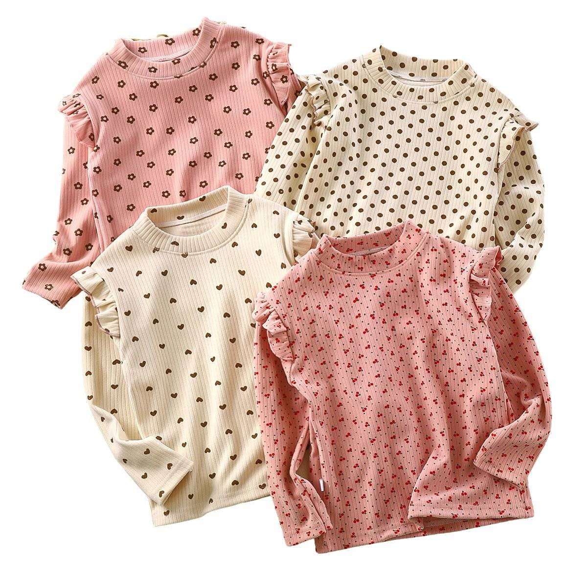 Toddler wearing Feather & Fawn ribbed ruffle long sleeve top