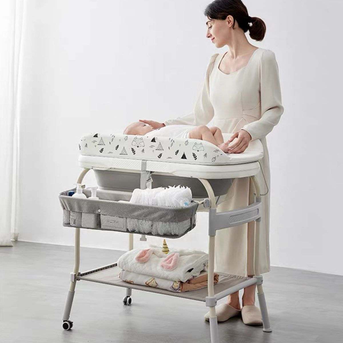 Toddly FlexiBathe 2-in-1 adjustable baby bathtub and changing table with storage and lockable wheels