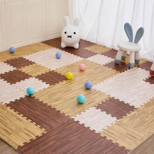 BabiePlay Wood Grain EVA Foam Play Mat with interlocking 16-piece puzzle tiles in white, deep, and dark wood colors, soft and safe for babies with a non-slip surface.
