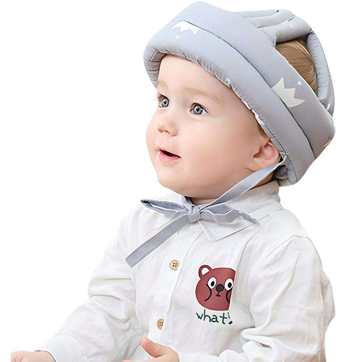Baby wearing breathable, adjustable Feather & Fawn ProtectCap safety helmet for head protection during play