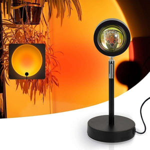 Glowly Sunset Lamp projecting warm orange light with modern black stand and USB power for photography and ambient lighting