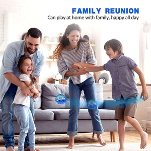 Happy family playing indoors with Kidst Flying Drone glowing in blue light