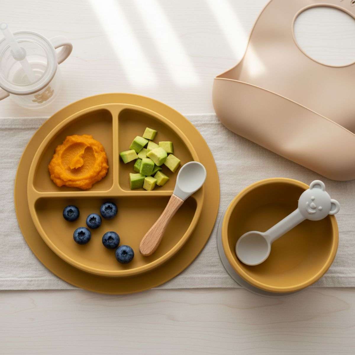 Silicone baby feeding sets with bowls, utensils, and bib