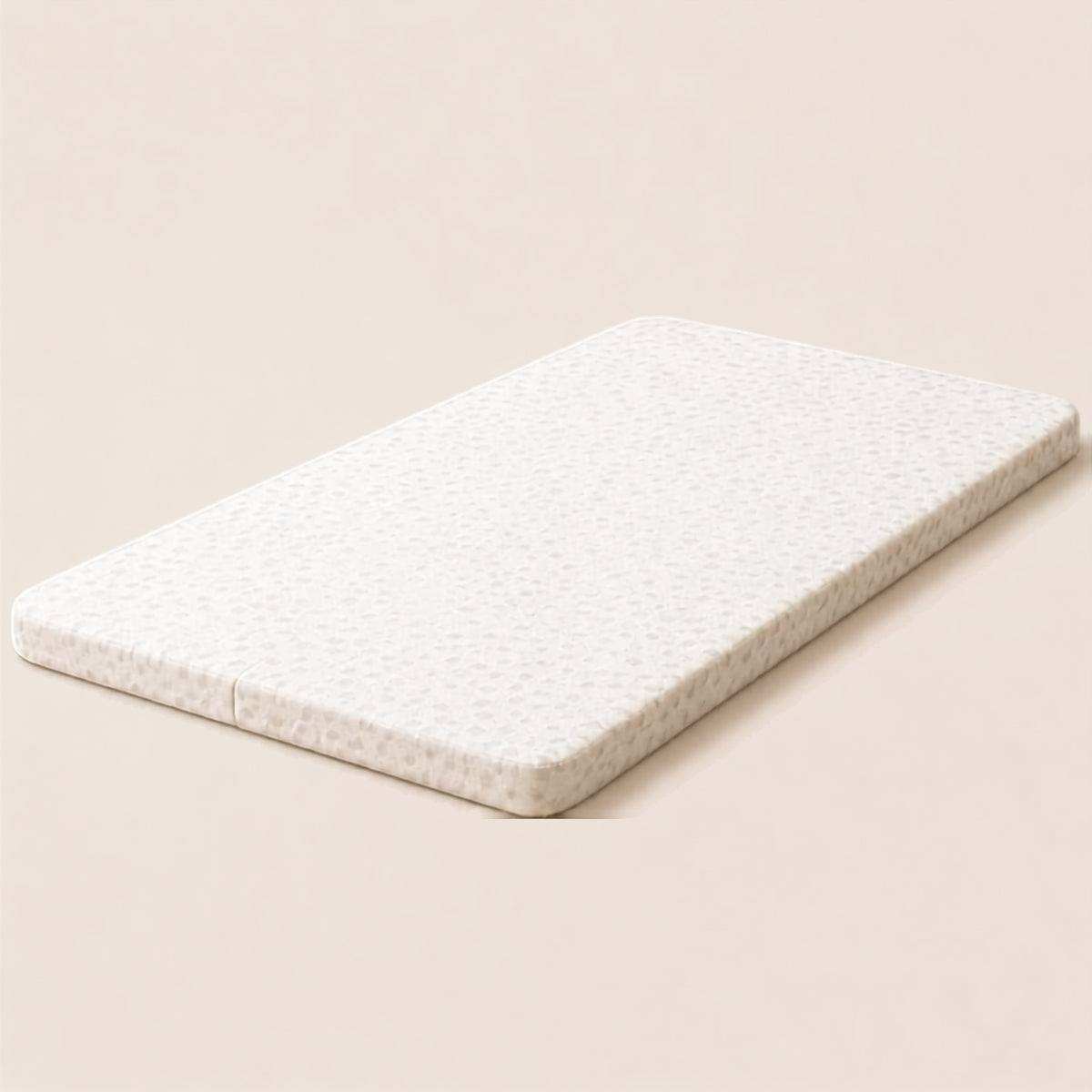 Baby bassinet & bedside co-sleeper mattress in light beige with subtle dotted pattern and soft fabric cover