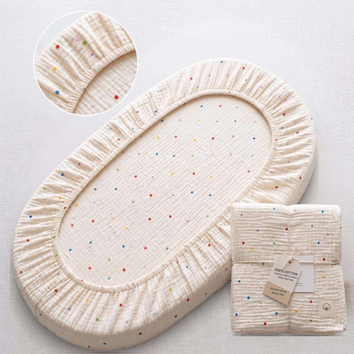Baby Bassinet & Bedside Co-Sleeper fitted sheet in cream cotton with small colorful polka dots pattern, elastic edges