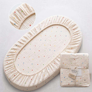 Baby Bassinet & Bedside Co-Sleeper fitted sheet in cream cotton with small colorful polka dots pattern, elastic edges