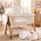 Baby Bassinet & Bedside Co-Sleeper in cream linen-cotton fabric with wood-grain steel frame, mesh side panels, attached mosquito net and under-bassinet storage