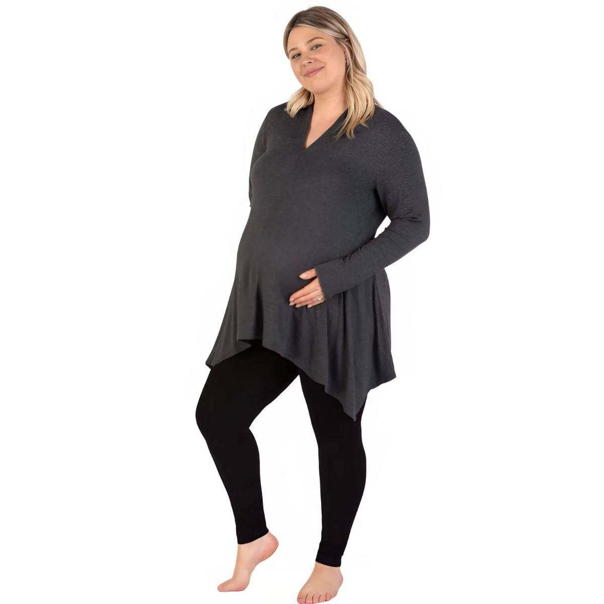 Maternity Leggings in black, smooth opaque stretch fabric with a close fit and full-length legs on a pregnant model