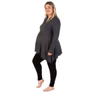 Maternity Leggings in black with a smooth, opaque finish and a stretchy fit, worn beneath a charcoal tunic