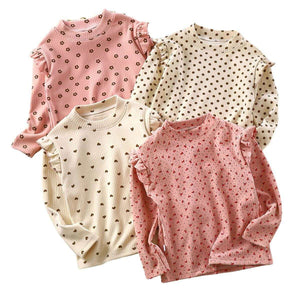 Toddler wearing Feather & Fawn ribbed ruffle long sleeve top